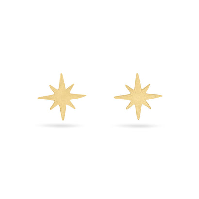 Solid gold north star shaped stud earrings on a white background