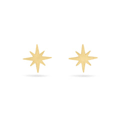 Solid gold north star shaped stud earrings on a white background