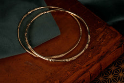 underwater river solid gold bangle patternated to look worn by water