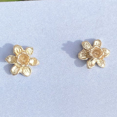 Tiny daffodil stud earrings in solid gold